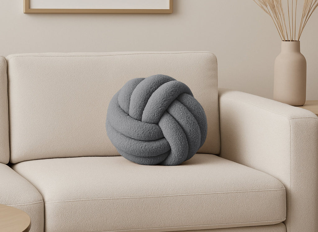 Coussin rond décoratif boule de nœud en effet peau de mouton gris foncé NODUS
