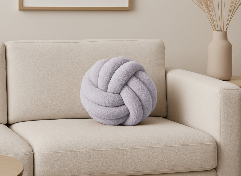 Coussin rond décoratif boule de nœud en effet peau de mouton gris clair NODUS