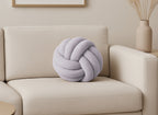 Coussin rond décoratif boule de nœud en effet peau de mouton gris clair NODUS