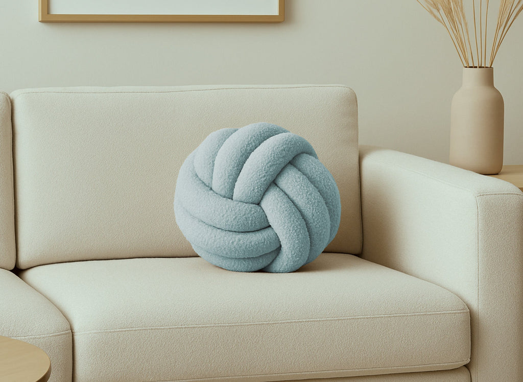 Coussin rond décoratif boule de nœud en effet peau de mouton bleu NODUS